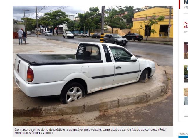 Carro é cimentado em calçada após briga entre vizinhos em BH - Foto: Reprodução/G1